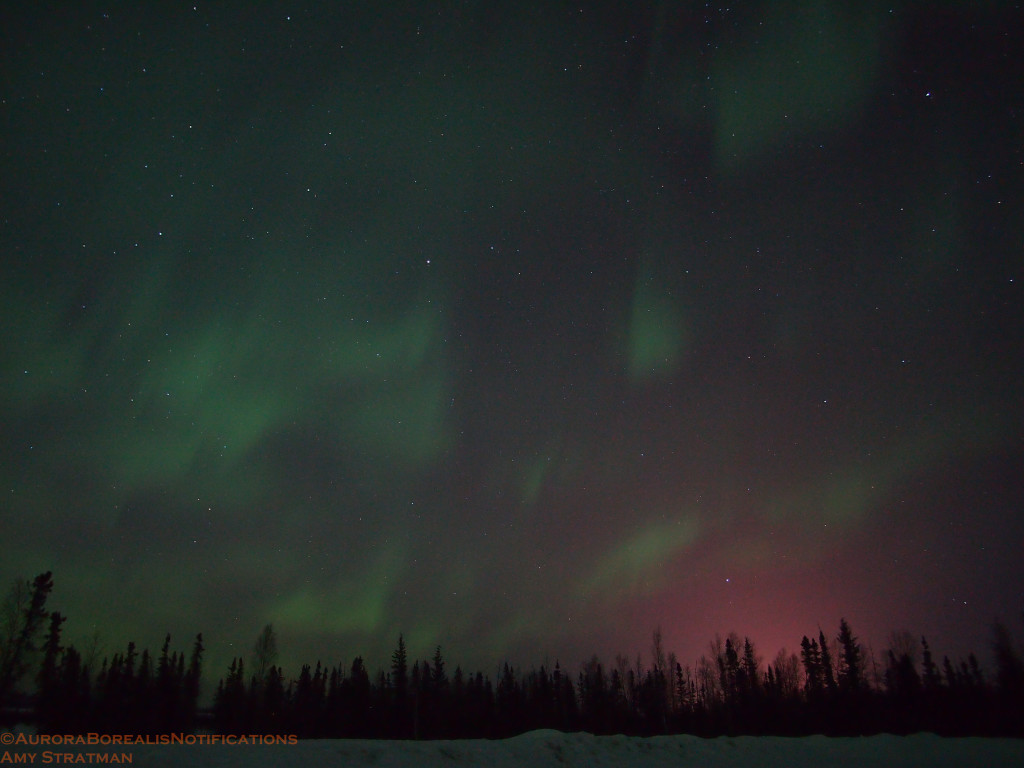 Eielson Air Force Base pink light pollution with green aurora